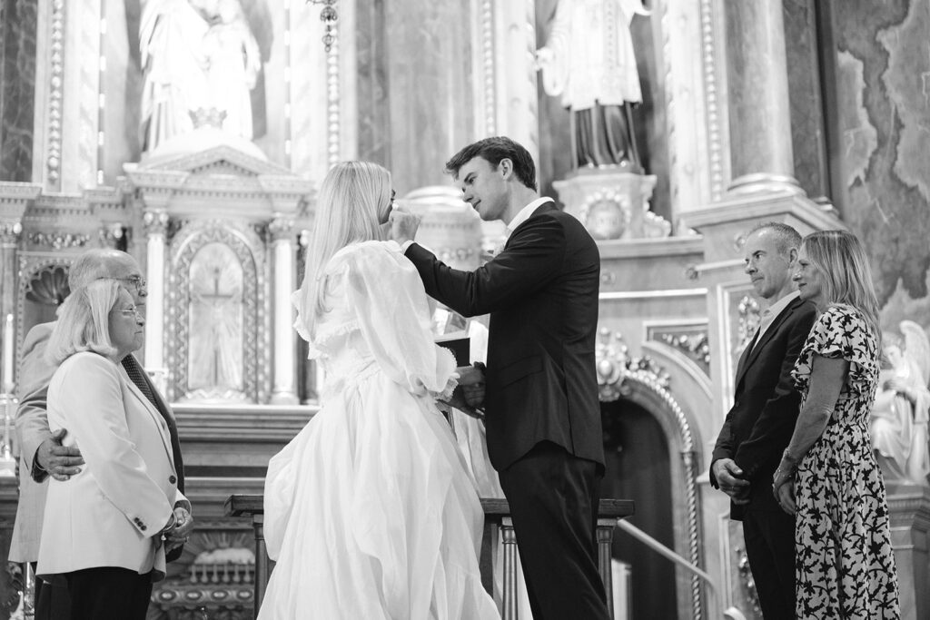 documentary photographer, st. louis documentary photographer, groom wiping away brides tears, elopement photography, St. Louis wedding photographer, Shrine of St. Joseph wedding, St. Louis elopement photographer, intimate wedding inspiration