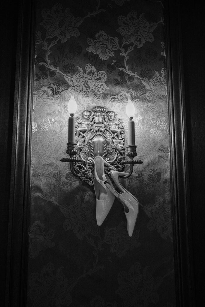 bridal shoes hanging in  historic mansion in Minnesota