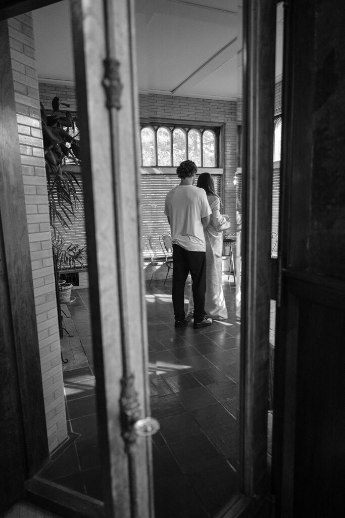 bride and groom getting ready together at the Cotton Mansion Duluth, Minnesota