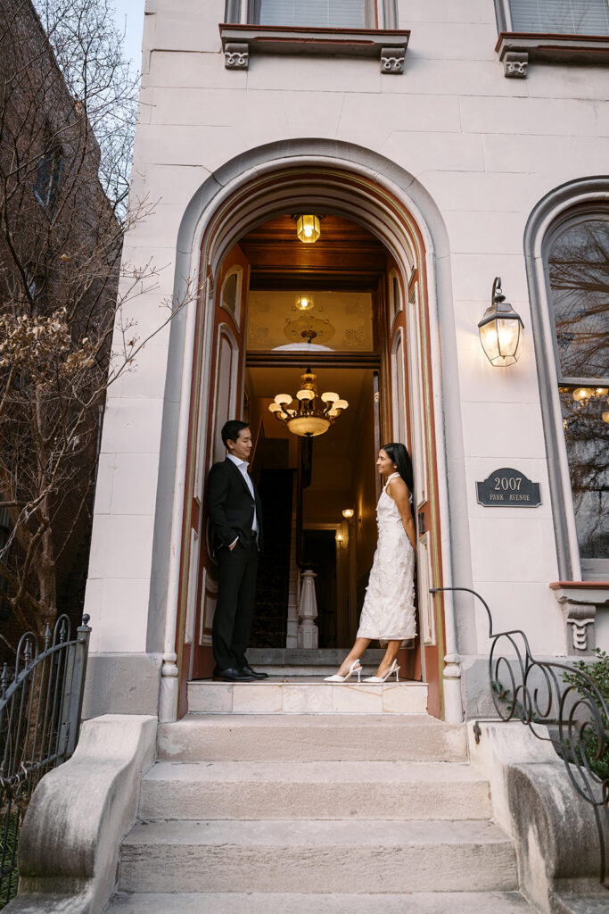 lafayette square historic home elopement, bride and groom on stairs 