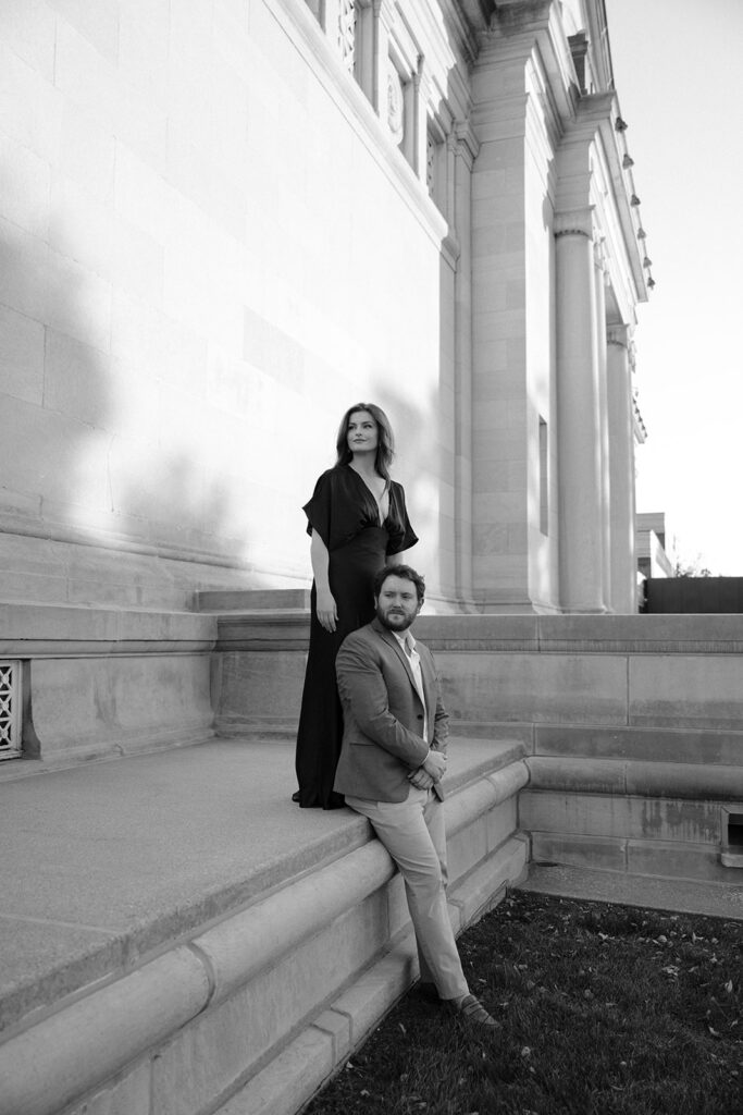 Forest Park engagement photos with couple walking near St. Louis Art Museum architecture