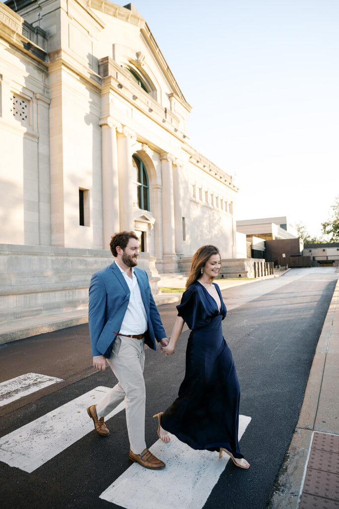 St. Louis Art Museum engagement session in Forest Park with couple walking hand in hand