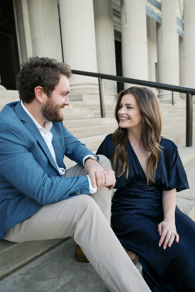 Candid St. Louis engagement photos outside Art Museum with natural movement and editorial style