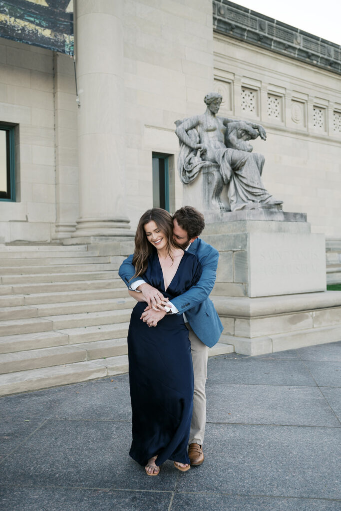 Candid St. Louis engagement photos outside Art Museum with natural movement and editorial style