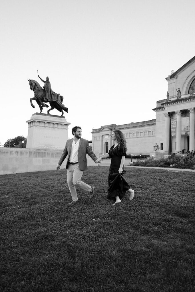 St. Louis Art Museum engagement session in Forest Park with couple walking hand in hand