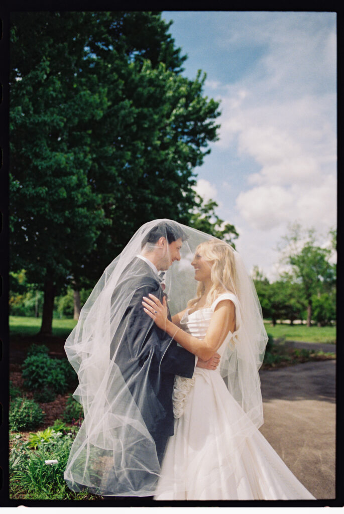 bride and groom in forest park captured on 35mm film 