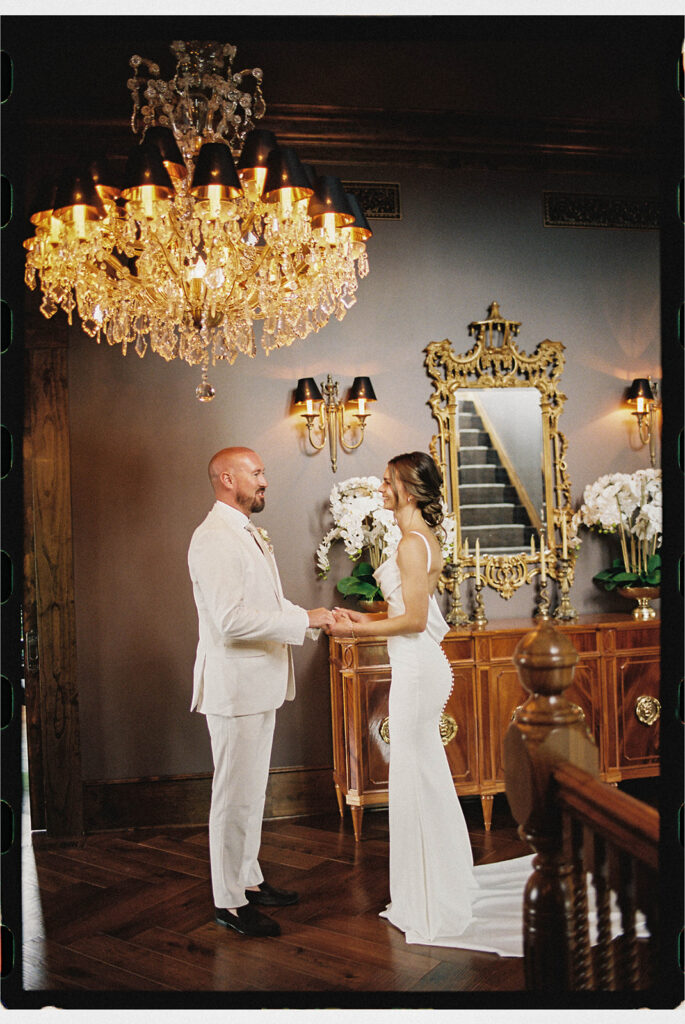 bride and groom first look on the Estate Washington staircase
